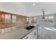 Modern kitchen with island and wood accent wall at 11377 Gravitation Dr # 0, Las Vegas, NV 89135