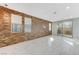 Spacious living room with wood-look wall and marble floors at 11377 Gravitation Dr, Las Vegas, NV 89135