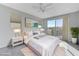 Main bedroom with sliding door to balcony and stylish decor at 11377 Gravitation Dr # 0, Las Vegas, NV 89135