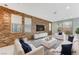 Living room features stylish wood accent wall, modern decor, and sliding glass door to the backyard at 11377 Gravitation Dr, Las Vegas, NV 89135