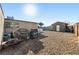 Large backyard with gravel, shed, and space for outdoor entertaining at 1215 Ferguson Ave, North Las Vegas, NV 89030