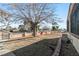 Landscaped front yard with mature tree at 1215 Ferguson Ave, North Las Vegas, NV 89030