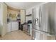 Kitchen with stainless steel appliances and laundry closet at 1215 Ferguson Ave, North Las Vegas, NV 89030