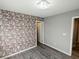 Bedroom with wood-like floors and accent wall at 12815 Alcores St, Las Vegas, NV 89141