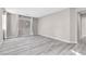 Spacious bedroom with light gray walls and modern laminate flooring at 12815 Alcores St, Las Vegas, NV 89141