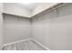 Walk-in closet with laminate flooring and basic shelving at 12815 Alcores St, Las Vegas, NV 89141