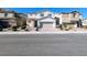 Two-story house with attached garage and landscaping at 12815 Alcores St, Las Vegas, NV 89141