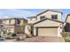 Charming two-story home featuring a well-maintained yard and a two-car garage at 12815 Alcores St, Las Vegas, NV 89141