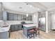 Modern kitchen with stainless steel appliances, gray cabinets, and a center island at 12815 Alcores St, Las Vegas, NV 89141