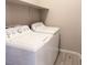 Bright laundry room with washer and dryer, and added shelving at 12815 Alcores St, Las Vegas, NV 89141