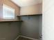 Large walk-in closet with double hanging rods and shelving at 12815 Alcores St, Las Vegas, NV 89141