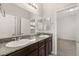 Double sink bathroom with granite countertop and mirrors at 1282 Paseo Del Oso Ln, Henderson, NV 89002