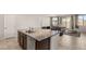 Kitchen island with sink and view into living room at 1282 Paseo Del Oso Ln, Henderson, NV 89002