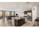 Spacious kitchen island with granite countertops and dark cabinetry at 1282 Paseo Del Oso Ln, Henderson, NV 89002