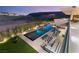 Aerial view of the property with a long pool, chess set, and desert landscape backdrop at 14 Magic Stone Ln, Las Vegas, NV 89135