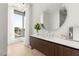 Modern bathroom featuring a large, round mirror and hardwood floors at 14 Magic Stone Ln, Las Vegas, NV 89135