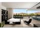 Sleek main bedroom with private outdoor living space with pool and mountain views through the wide sliding glass doors at 14 Magic Stone Ln, Las Vegas, NV 89135