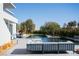 Beautiful backyard featuring a modern pool, inviting outdoor seating, and lush landscaping, creating a serene retreat at 14 Magic Stone Ln, Las Vegas, NV 89135