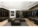 Spacious walk-in closet featuring custom shelving, seating area, and stylish decor at 14 Magic Stone Ln, Las Vegas, NV 89135