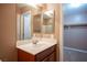 Bathroom with vanity and access to closet at 1525 Spiced Wine Ave # 23103, Henderson, NV 89074