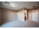 Bedroom with carpet, door to en-suite bathroom, and neutral walls at 1525 Spiced Wine Ave # 23103, Henderson, NV 89074