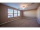 Spacious bedroom with ceiling fan and three windows at 1525 Spiced Wine Ave # 23103, Henderson, NV 89074