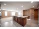 Open concept kitchen with large island and granite countertops at 1525 Spiced Wine Ave # 23103, Henderson, NV 89074