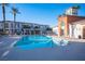 Community pool with lounge chairs and shaded seating area at 1525 Spiced Wine Ave # 23103, Henderson, NV 89074