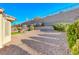 Landscaped backyard with gravel and artificial turf at 1664 Hartley Ave, Henderson, NV 89052