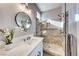 Modern bathroom with white vanity, frameless shower, and stylish fixtures at 1664 Hartley Ave, Henderson, NV 89052