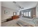 Bright bedroom with bay window, ceiling fan, and carpeted floor at 1664 Hartley Ave, Henderson, NV 89052