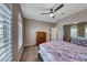 Charming bedroom with ceiling fan and arched windows at 1664 Hartley Ave, Henderson, NV 89052