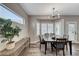 Bright dining area with a wood table and access to backyard at 1664 Hartley Ave, Henderson, NV 89052