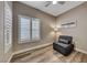 Small guest room with a sleeper sofa, window shutters, and wood-look flooring at 1664 Hartley Ave, Henderson, NV 89052