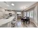 Modern kitchen with white cabinets, quartz countertops, and a breakfast bar at 1664 Hartley Ave, Henderson, NV 89052