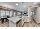 Eat-in kitchen with island, white cabinets and stainless steel appliances at 1664 Hartley Ave, Henderson, NV 89052