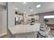 Modern kitchen with white cabinets, quartz countertops, and stainless steel appliances at 1664 Hartley Ave, Henderson, NV 89052