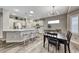 Modern kitchen with white cabinets, quartz countertops, and stainless steel appliances at 1664 Hartley Ave, Henderson, NV 89052