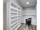 Built-in shelving and desk with seating in a home office at 1664 Hartley Ave, Henderson, NV 89052