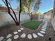 Landscaped backyard with artificial turf at 1804 Discus Dr, Las Vegas, NV 89108