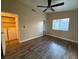 Spacious bedroom with wood-look floors and ceiling fan at 1804 Discus Dr, Las Vegas, NV 89108