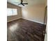 Well-lit bedroom with hardwood floor and window at 1804 Discus Dr, Las Vegas, NV 89108