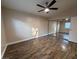 Bright bedroom with wood-look floors and mirrored closet at 1804 Discus Dr, Las Vegas, NV 89108