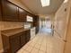 Kitchen features dark cabinets, granite counters, and patio access at 1804 Discus Dr, Las Vegas, NV 89108