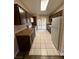 Kitchen with dark wood cabinets and tile floors at 1804 Discus Dr, Las Vegas, NV 89108