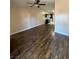 Open living room with kitchen view and hardwood floors at 1804 Discus Dr, Las Vegas, NV 89108