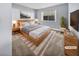 Virtually staged main bedroom with light wood furniture and gray walls at 2080 Karen Ave # 49, Las Vegas, NV 89169