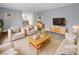 Virtually staged living room featuring light beige furniture and wood flooring at 2080 Karen Ave # 49, Las Vegas, NV 89169