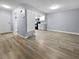 Bright living room featuring light gray walls and wood-look flooring at 2080 Karen Ave # 49, Las Vegas, NV 89169