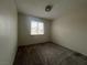 Bright bedroom with carpet flooring and a large window at 2104 Fountain View Dr, Las Vegas, NV 89134